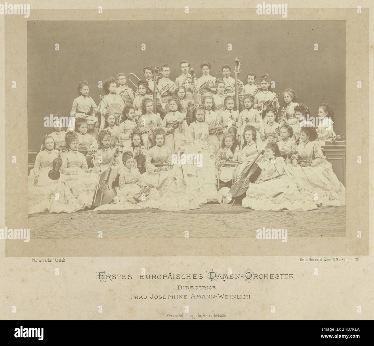 Group portrait of the first European women's orchestra conducted by Josefine Amann-Weinlich, Erstes Europäisches Damen-Orchester (title on object), Heinrich Harmsen (mentioned on object), Vienna, 1868 - 1887, cardboard, paper, albumen print, height 328 mm × width 434 mm Stock Photo