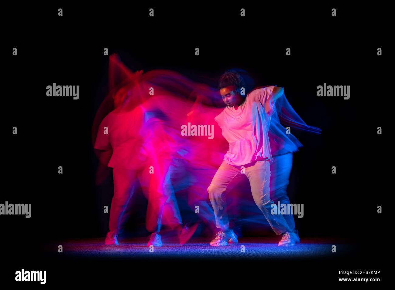 One young sportive girl in white costume dancing hip-hop dance isolated ...
