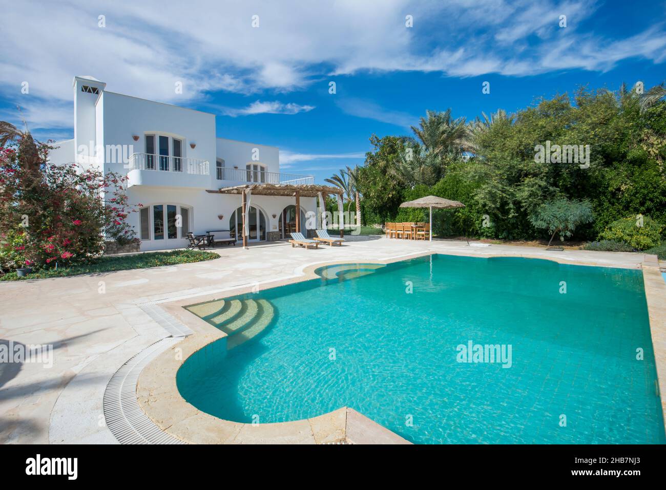 Exterior of luxury holiday villa show home in tropical summer resort