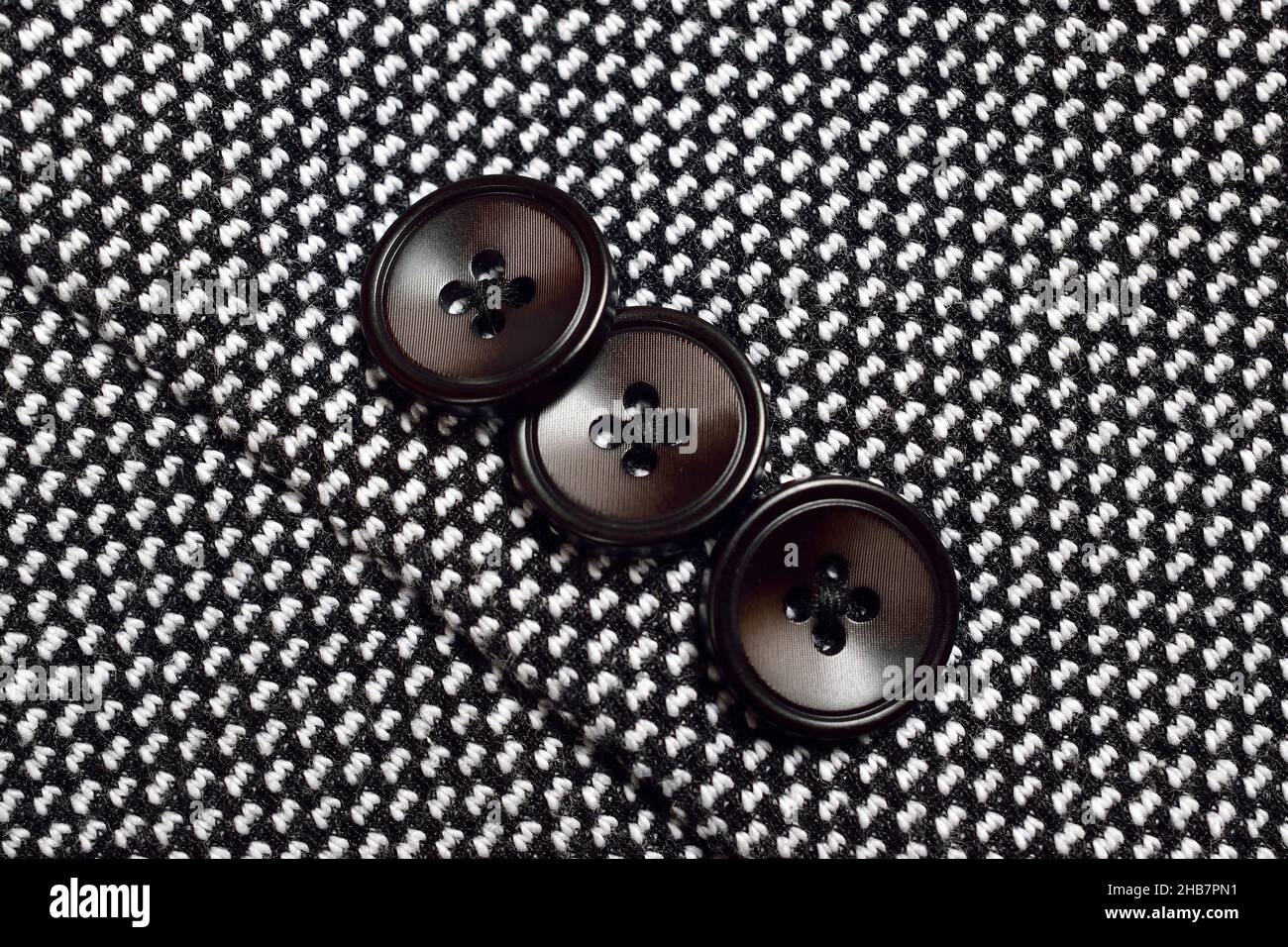 Black Button on Tweed Suit Stock Photo