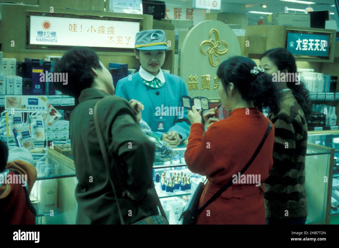 a Women in Uniform at a shopping center in the City center of Xian in the Provinz of Shaanxi in China.  China, Xian, October, 1997 Stock Photo