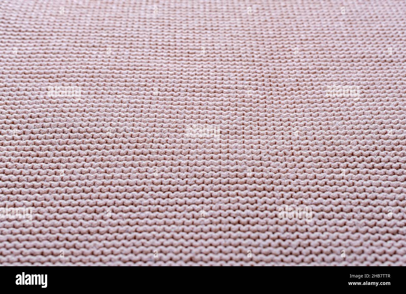 Knitted fabric texture. The pattern is clearly visible. Stock Photo
