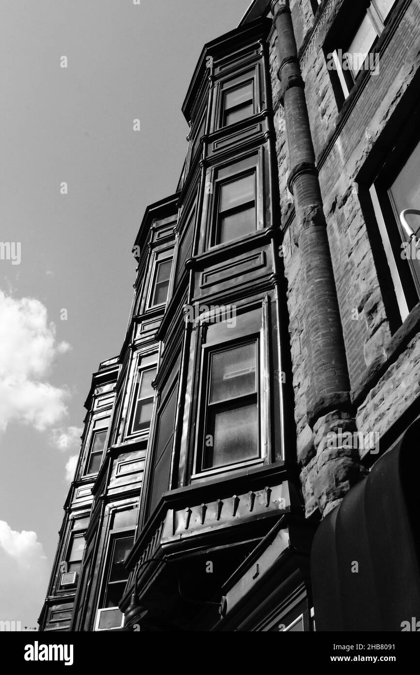 Vertical grayscale shot of the building facade Stock Photo - Alamy
