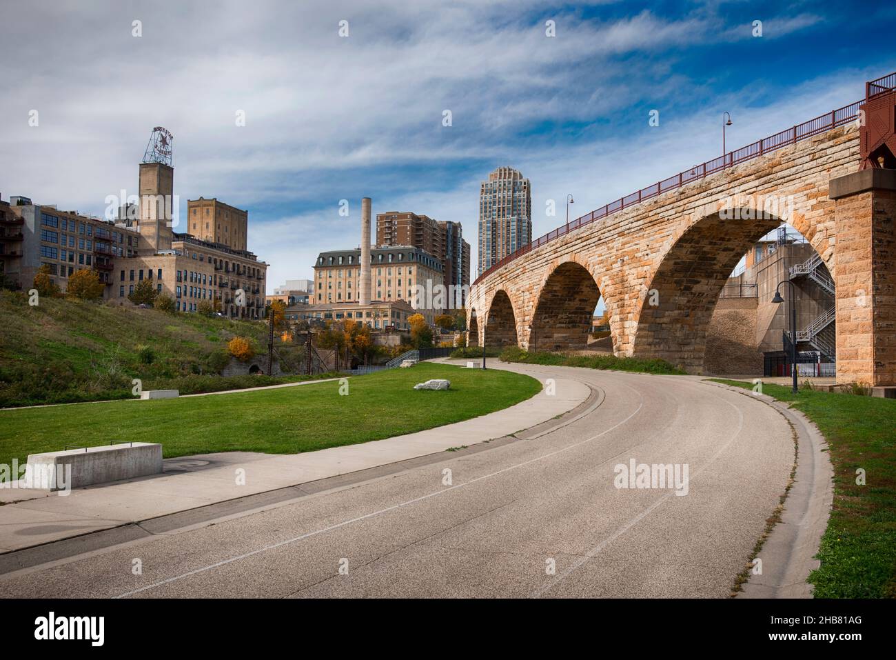 Minneapolis skyline, Stone Arch Bridge, bike path. Minnesota Stock Photo