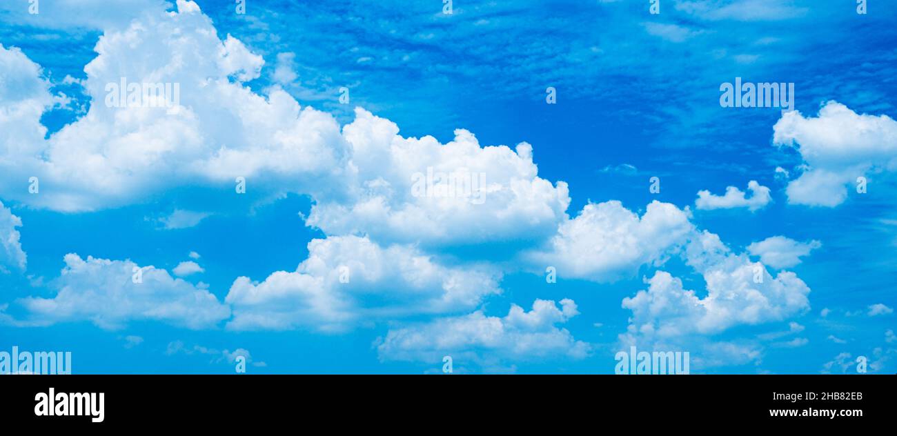 white fluffy clouds sky background with blue sky background for copy ...