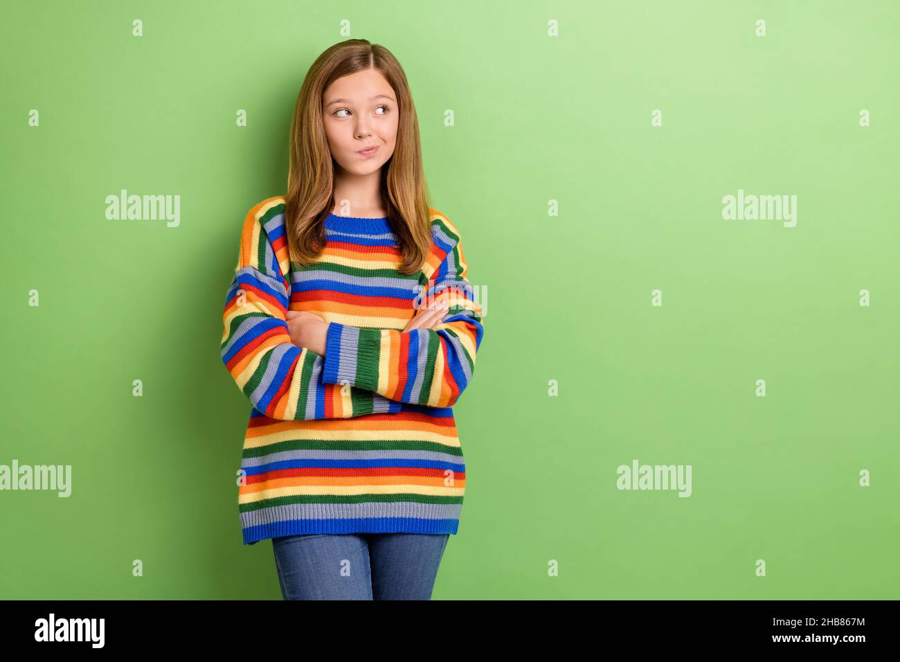 Portrait of attractive girly doubtful curious girl folded arms