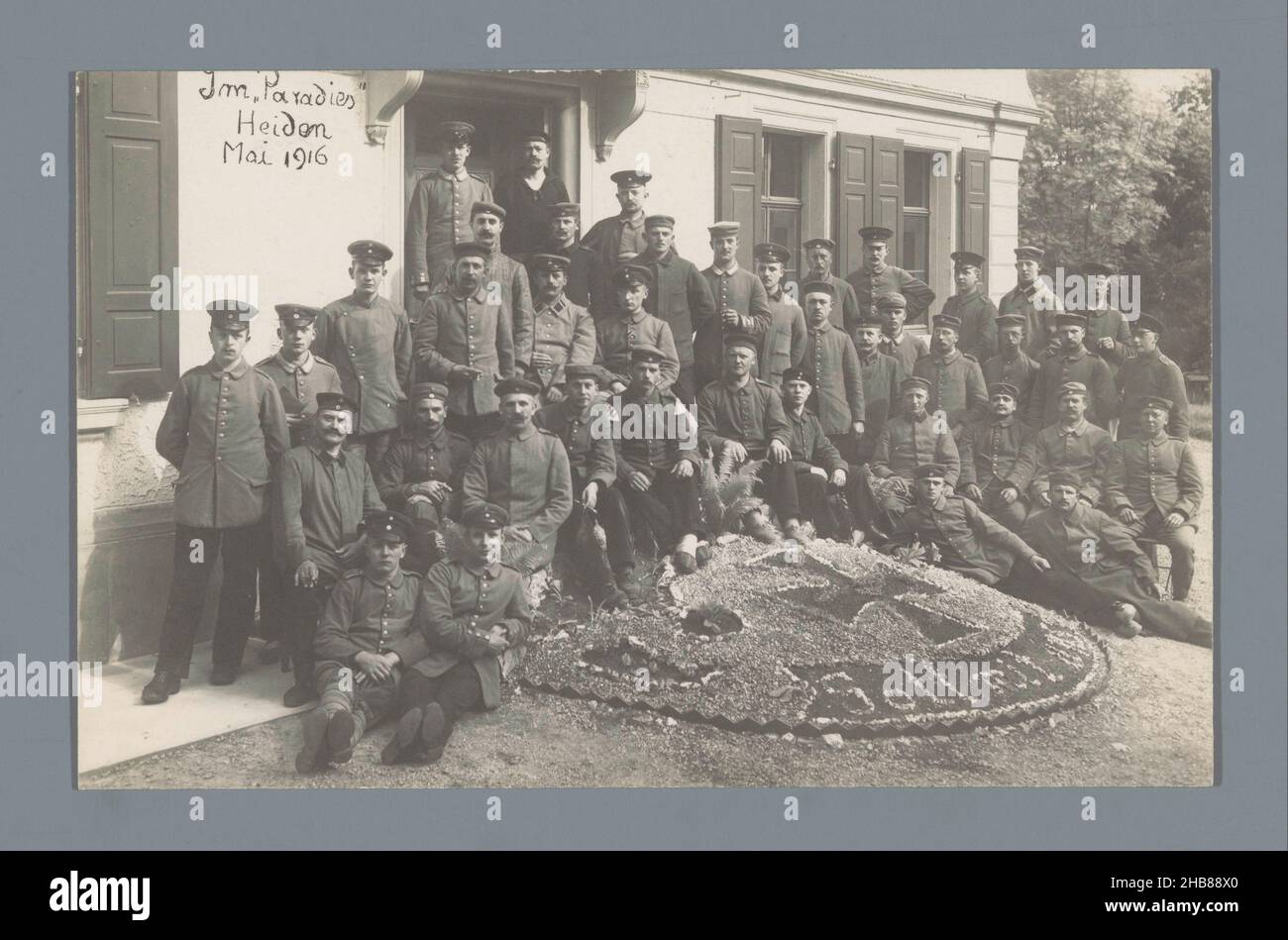 Group portrait of soldiers in uniform in front of a building in Heiden, anonymous, Heiden, May-1916, photographic support, gelatin silver print, height 88 mm × width 137 mm Stock Photo