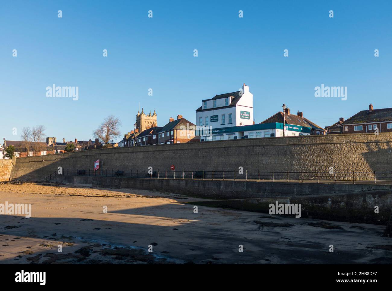The seafront at the Headland,Hartlepool,England,UK with the Pot House pub and St Hildas Church in background Stock Photo
