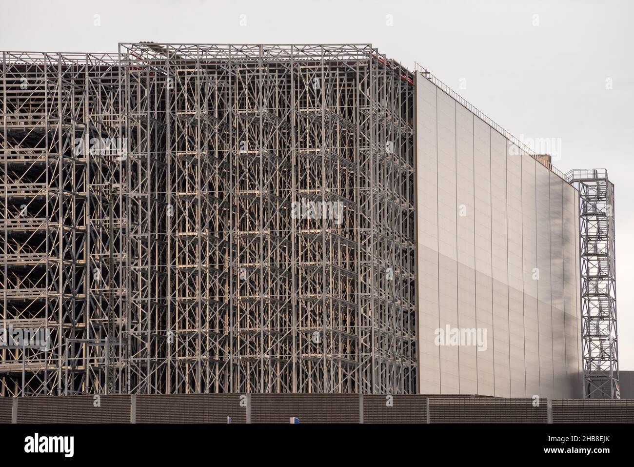 Warehouse under construction without external wall. Metal shelves of a ...
