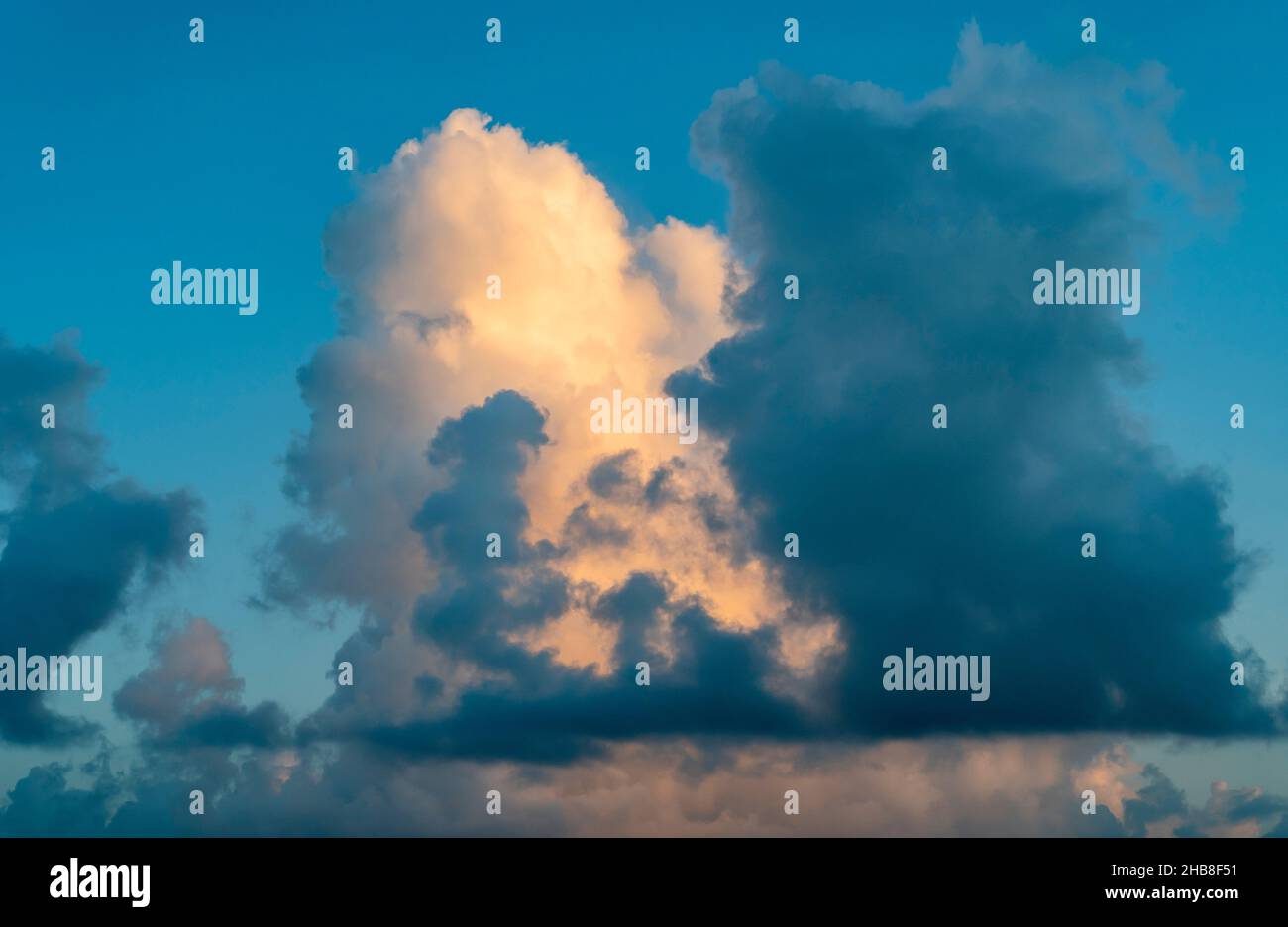 Large golden cumulus cloud against sky Stock Photo