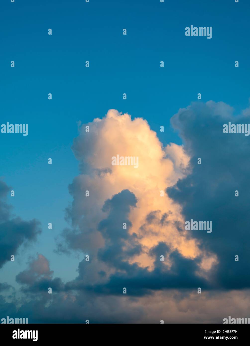 Large golden cumulus cloud against sky Stock Photo