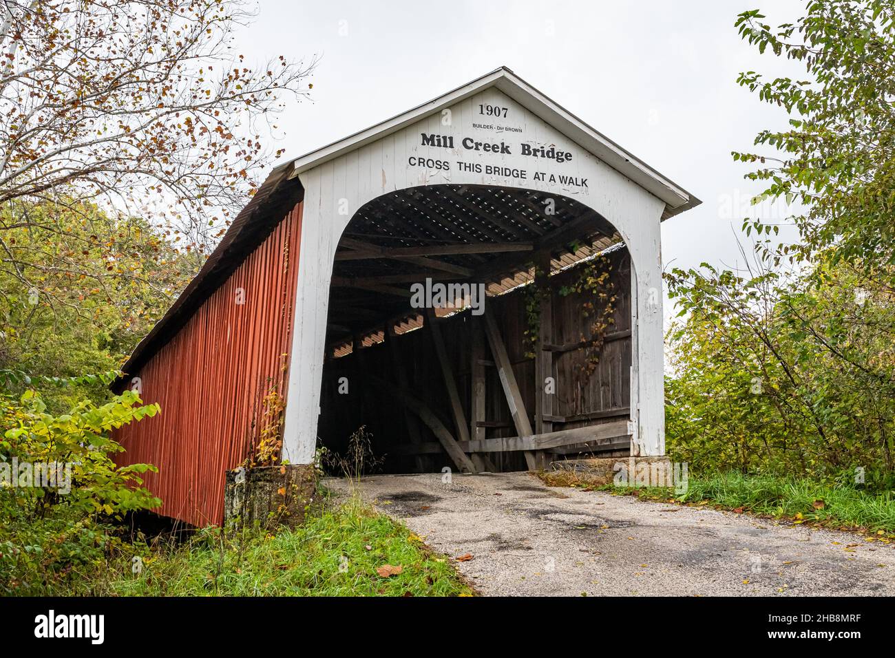 The Mill Creek Covered Bridge crosses Mill Creek during Autumn leaf