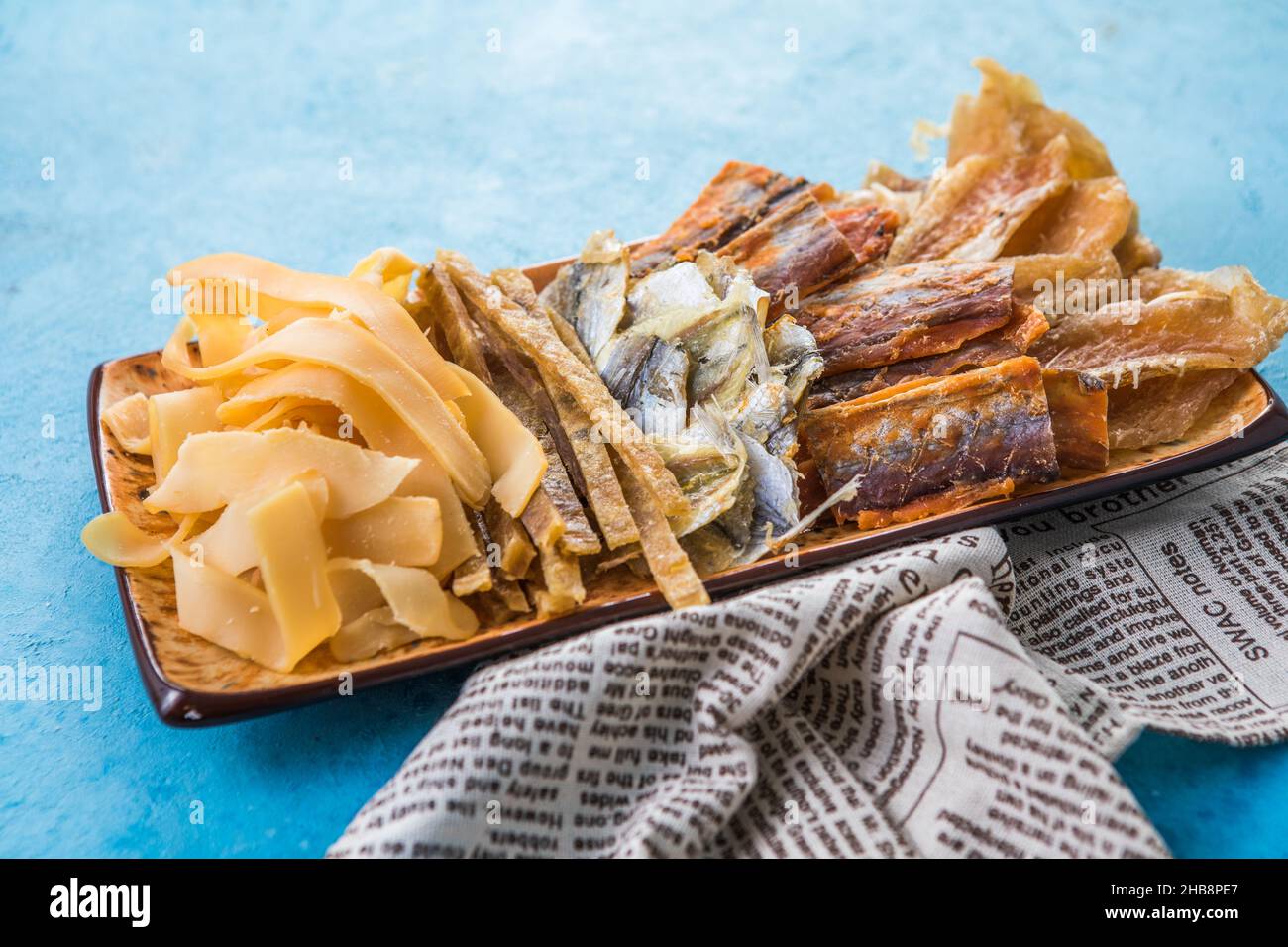 Dried Seafood Mix with Squid, Tuna, codfishon, yellow minke on Plate
