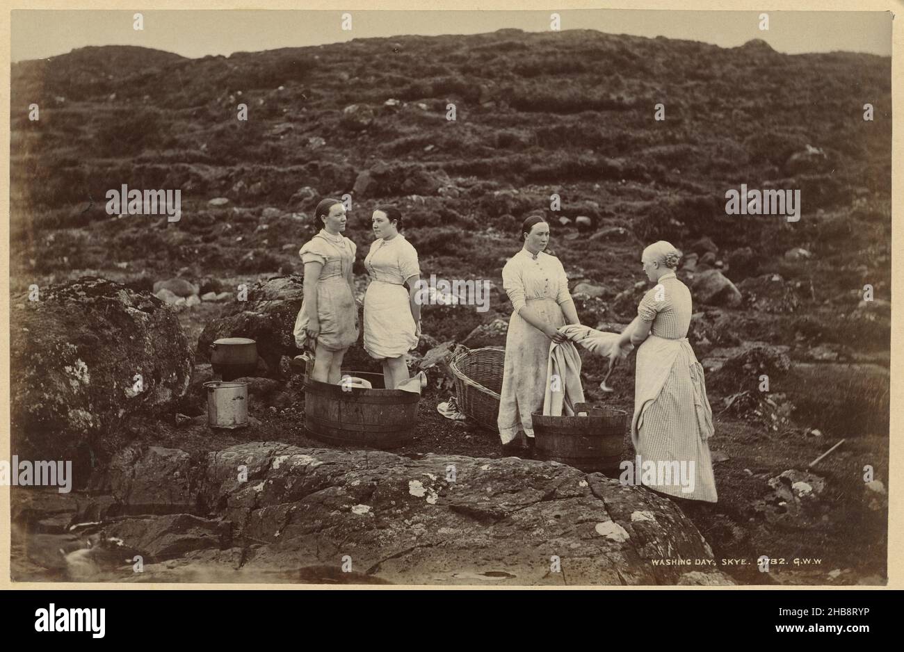 Four unknown women with tubs and laundry on Skye, Washing day, Skye (title on object), George Washington Wilson (mentioned on object), Skye, 1860 - 1880, paper, cardboard, albumen print, height 185 mm × width 285 mmheight 245 mm × width 362 mm Stock Photo