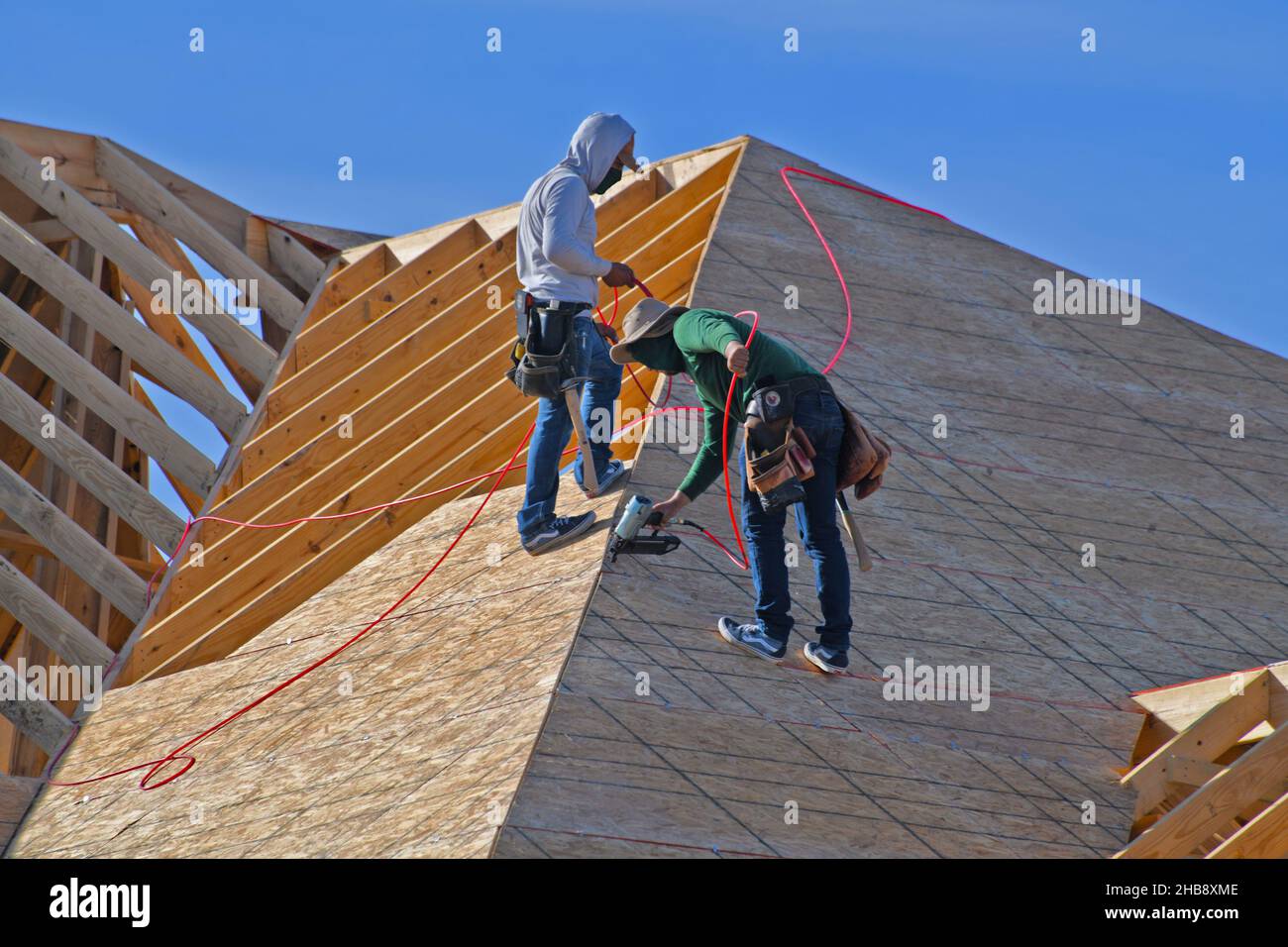 Residential Construction of roofing new homes. Stock Photo