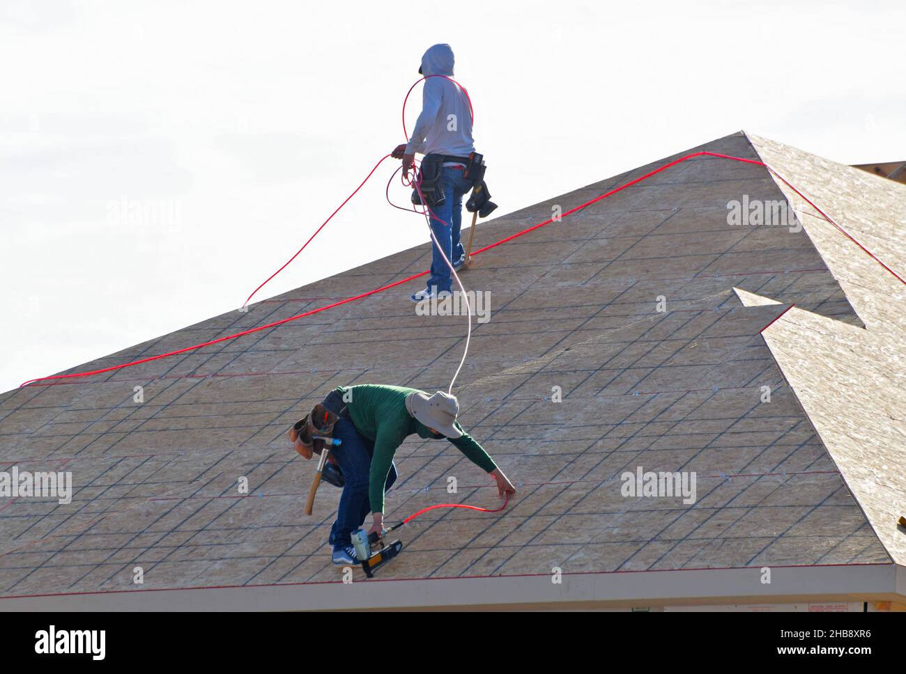 Residential Construction of roofing new homes. Stock Photo