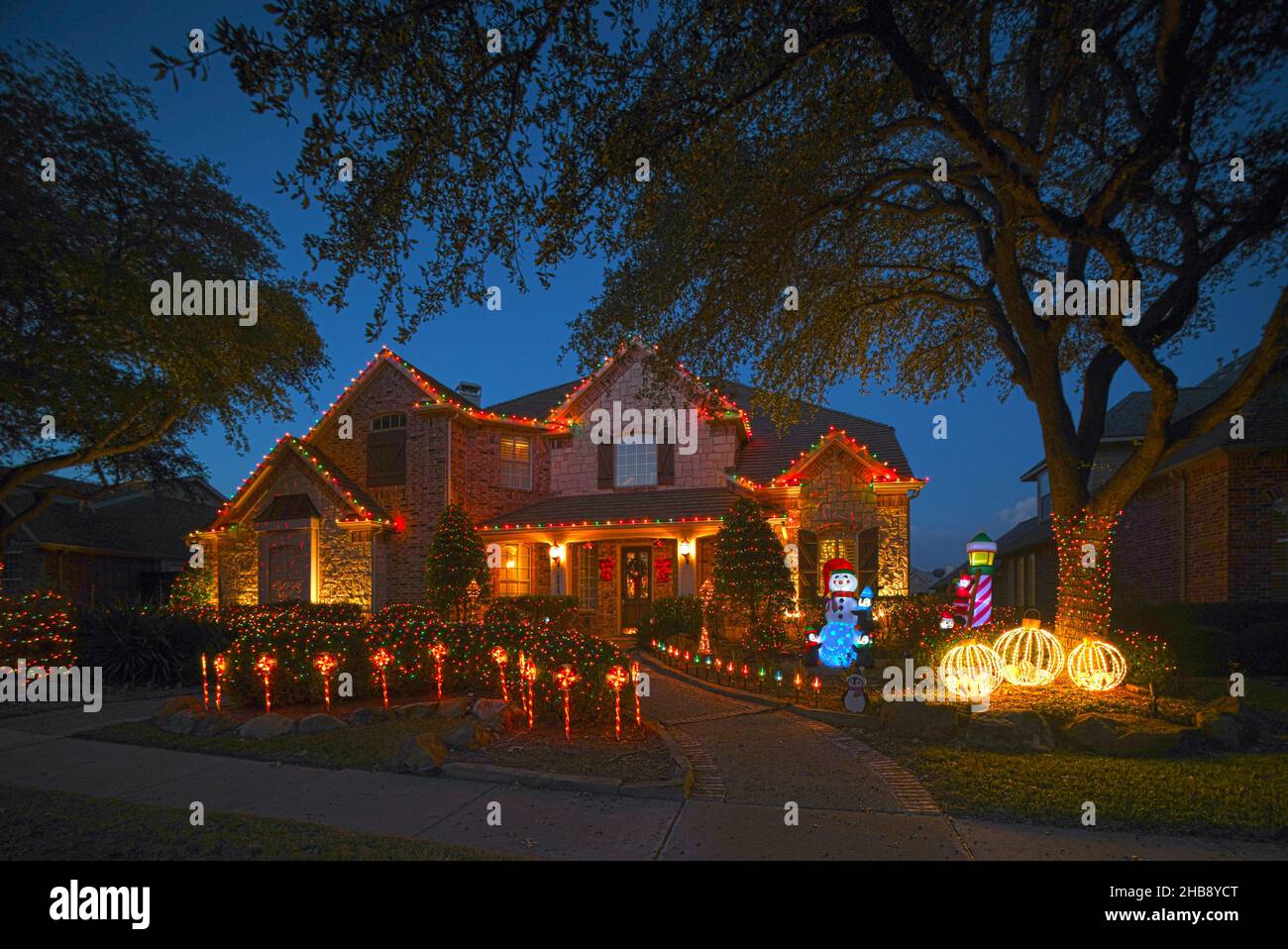 Residences decorated with Christmas lights for the Christmas season. Stock Photo