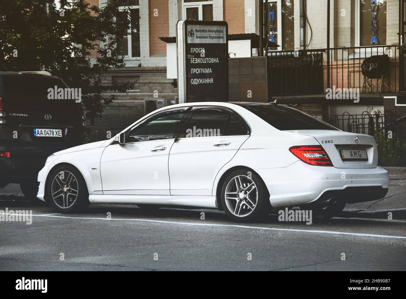 Kiev, Ukraine - May 22, 2021: White Mercedes-Benz C250 with AMG numbers is parked in the city Stock Photo