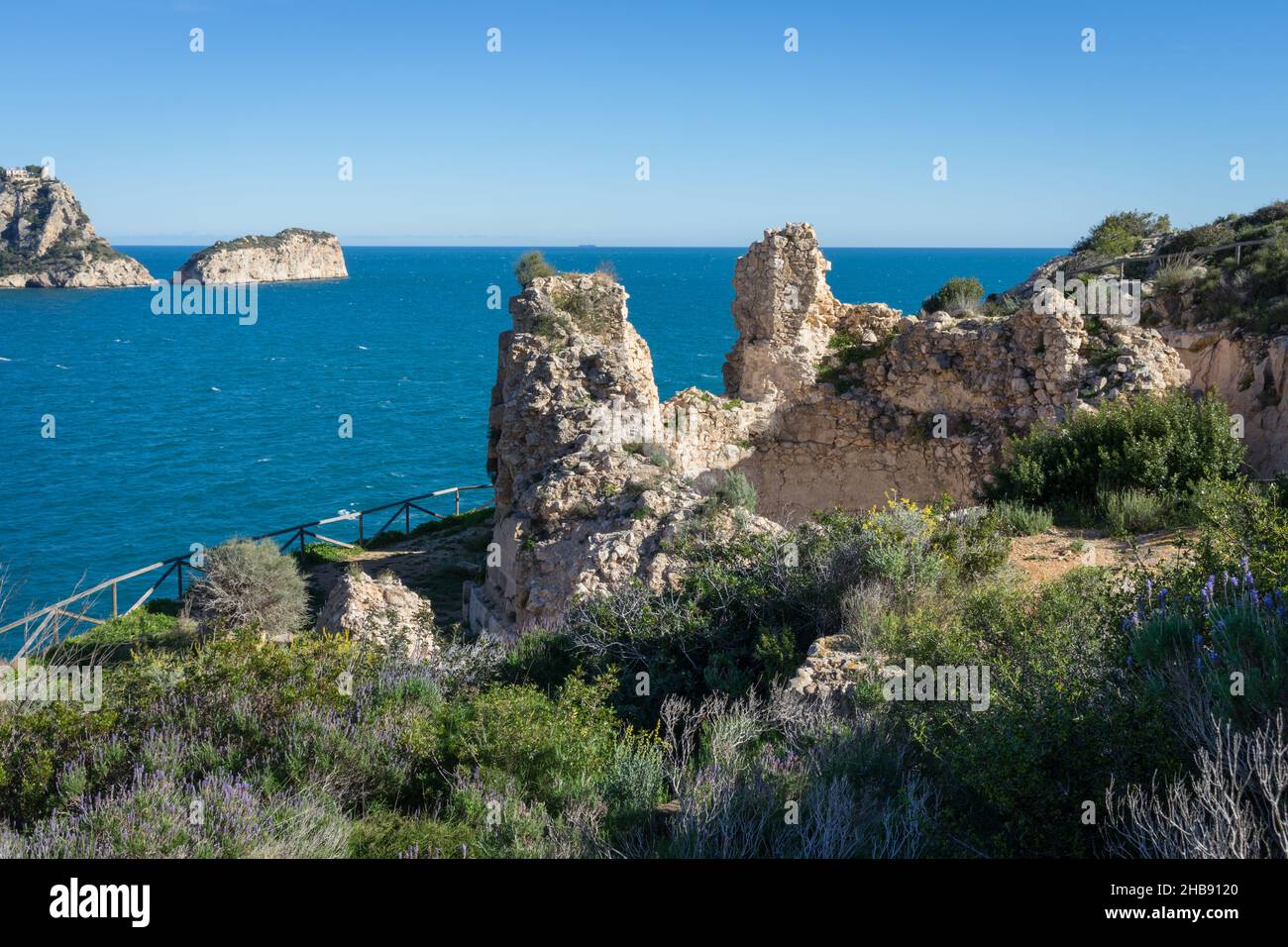picutesque ruin of a historic castle on the Mediterranean coast in Spain Stock Photo