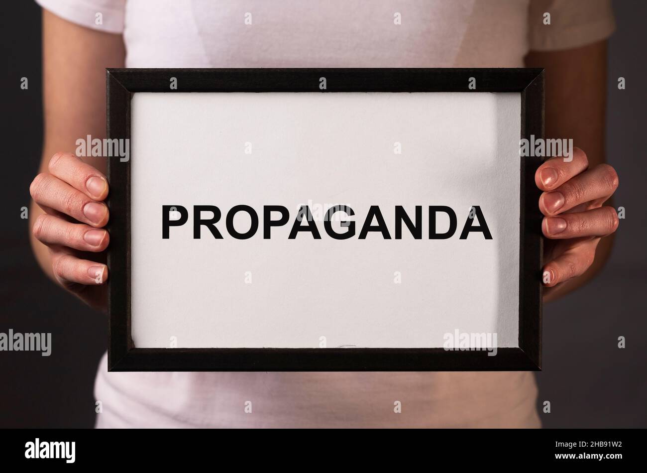 Propaganda word on paper. Manipulation and brainwash campaign by media concept. Stock Photo