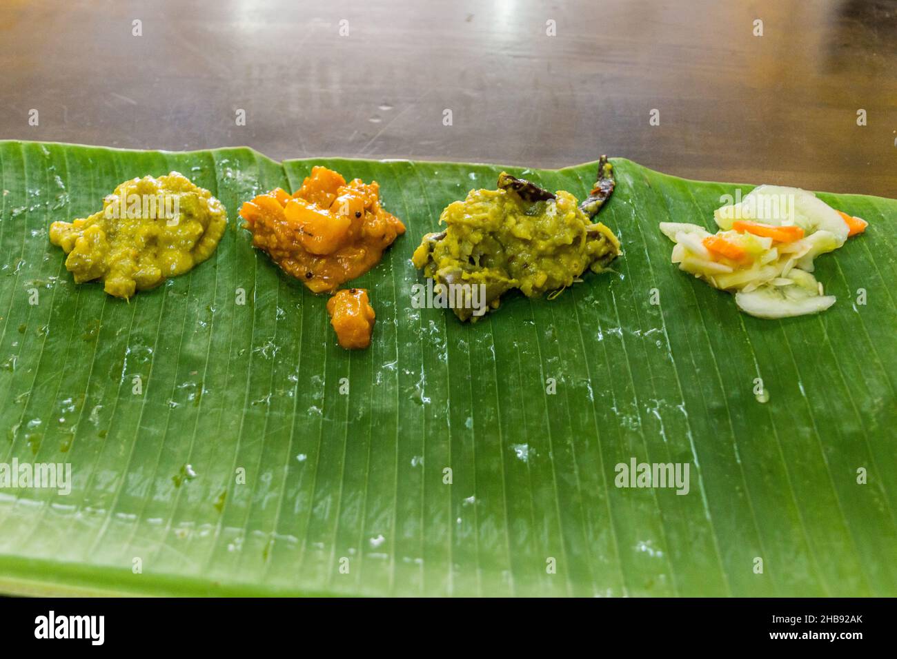 Thali, indian dish, served on a banana leaf Stock Photo