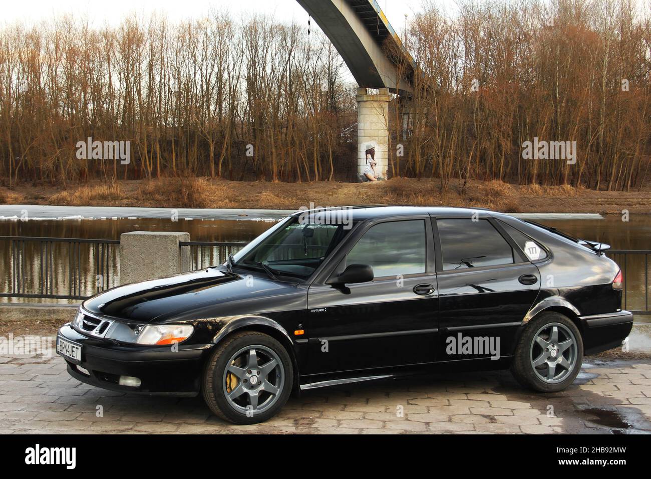 Chernihiv, Ukraine - March 20, 2021: Old Swedish car Saab 900 Turbo on the background of the bridge Stock Photo