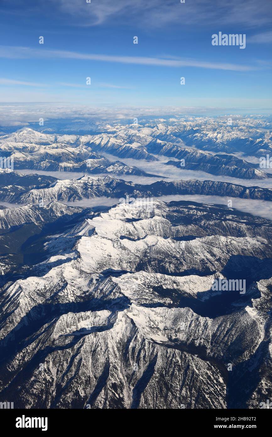 The Earth from Above: Aerial View of Snow covered mountains. Stock Photo