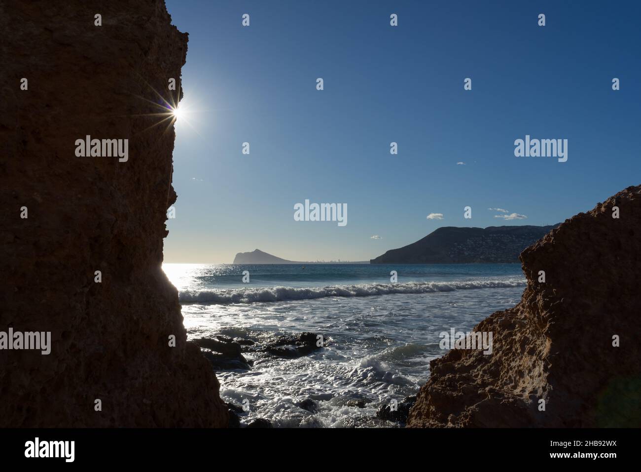 beautiful view of the mediterranean sea and silhouette of rocks with sunlight Stock Photo