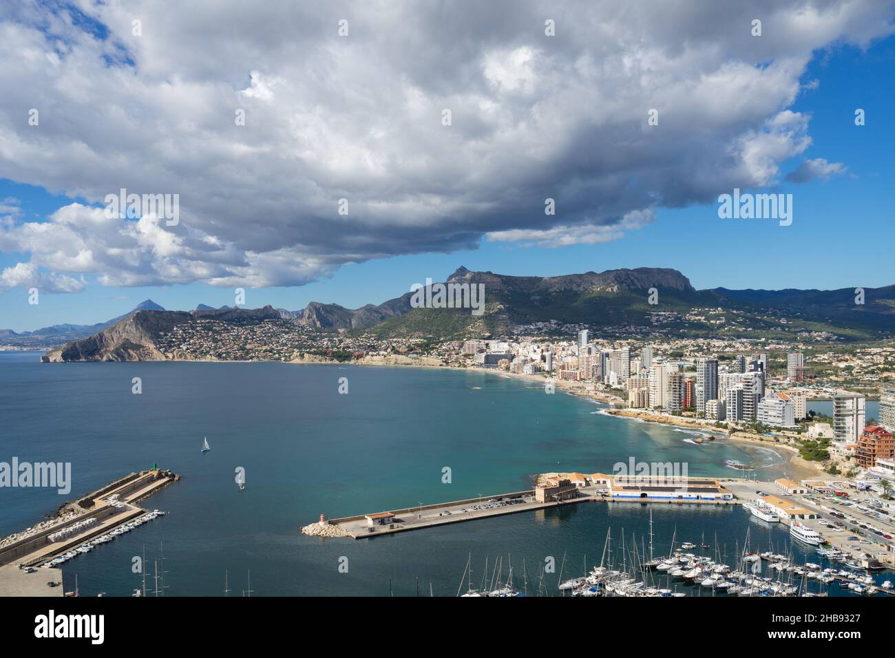 sailboats in the marina of Calpe and clouds on the Mediterranean coast in Spain Stock Photo