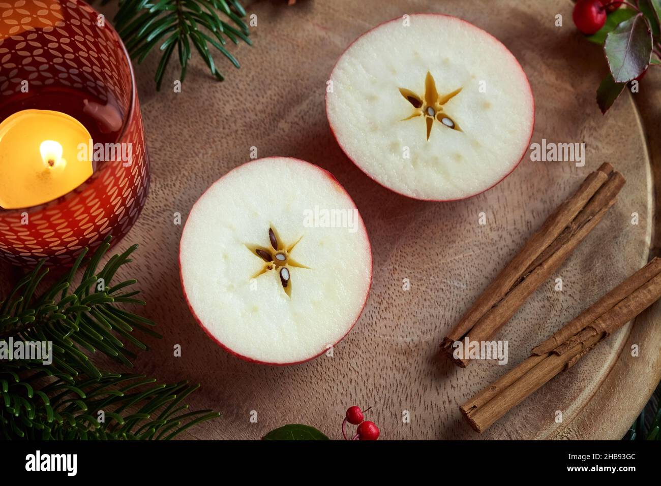 Red apple cut in two halves with a star in the middle - old Christmas custom Stock Photo