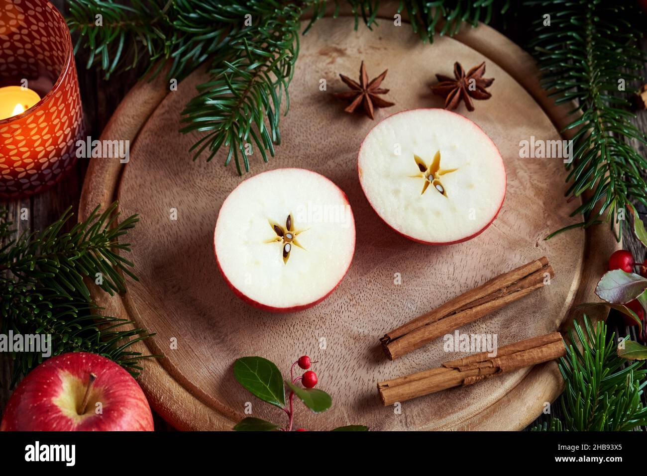 Christmas decoration with an apple cut in two halves with a star in the middle Stock Photo