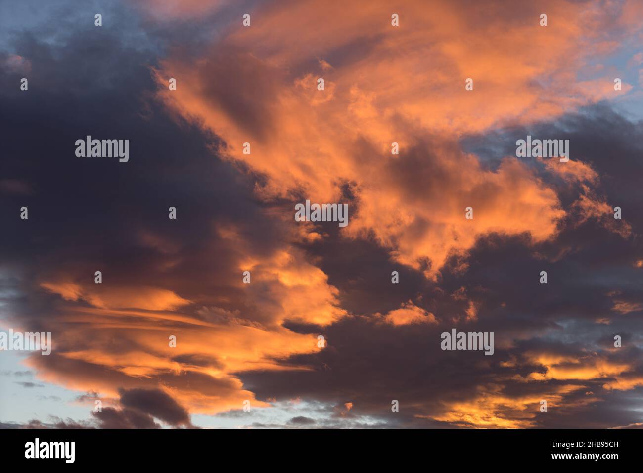 beautiful orange golden clouds at sunset on the mediterranean coast scenic sky background Stock Photo