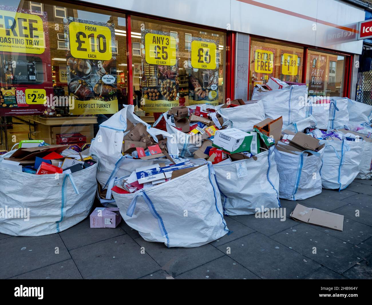 London. UK-12.10.2021. A huge pile of packaging materials for recycling outside a branch of Iceland supermarket. Stock Photo