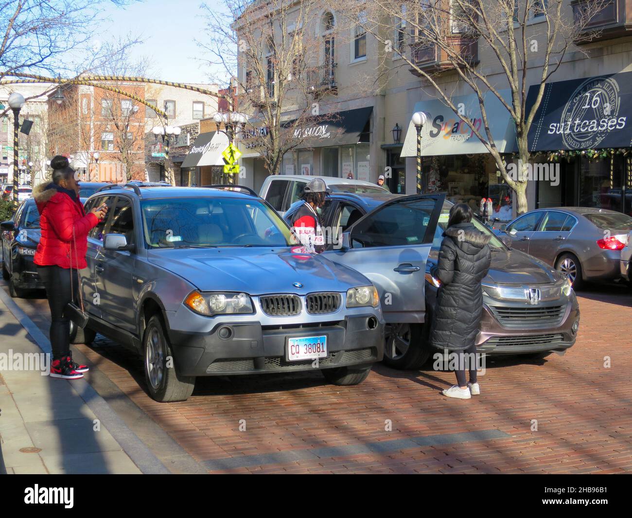 Automobile accident scene. Driver of parked car opened door into