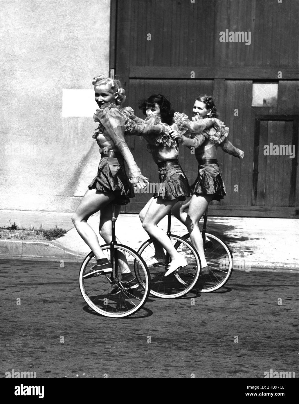 Girls unicycle Black and White Stock Photos & Images - Alamy