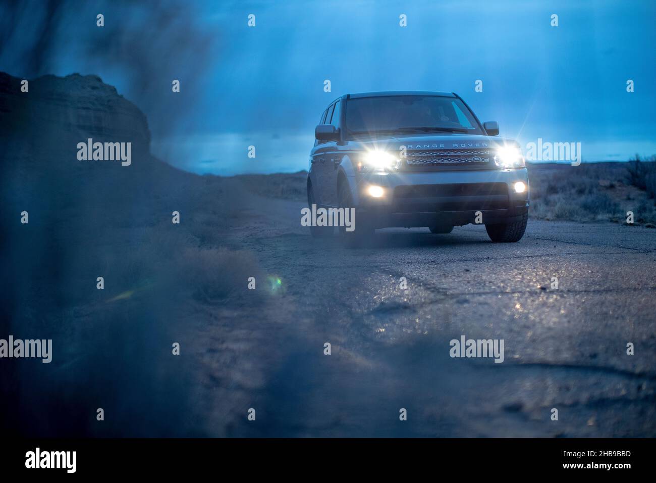 Range Rover driving in Utah at dusk Stock Photo