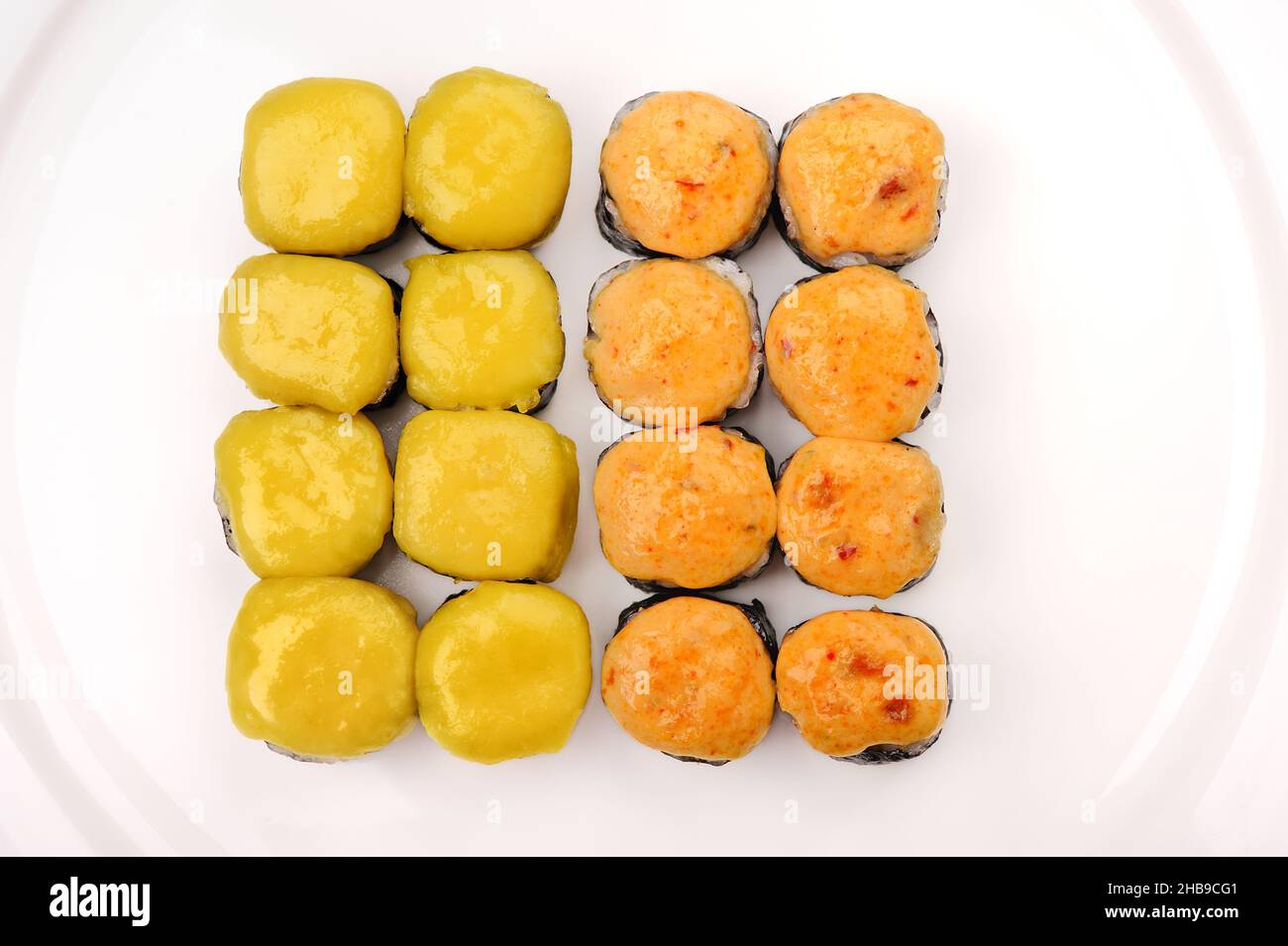 Set of baked cheese rools on white plate overhead view Stock Photo - Alamy