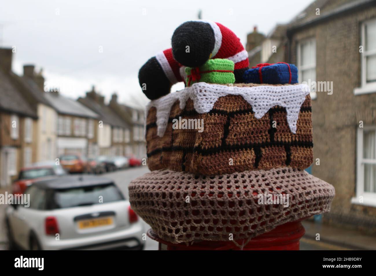 A Hat for a Post Box in Ely knitted by the Secret Yarn Bomber