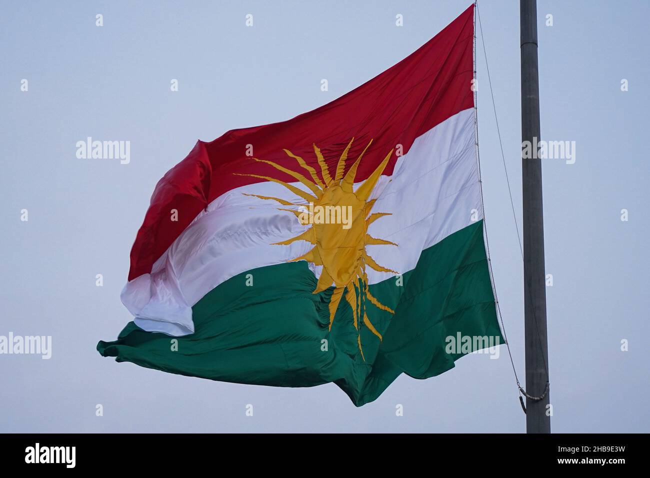 Duhok, Iraq. 17th Dec, 2021. The Kurdistan flag seen waving during the festival.In 2009, the Kurdistan Region Parliament declared December 17 to mark the Kurdish national flag day since it was first officially used by the Republic of Kurdistan known as the Republic of Mahabad on December 17, 1946. Credit: SOPA Images Limited/Alamy Live News Stock Photo