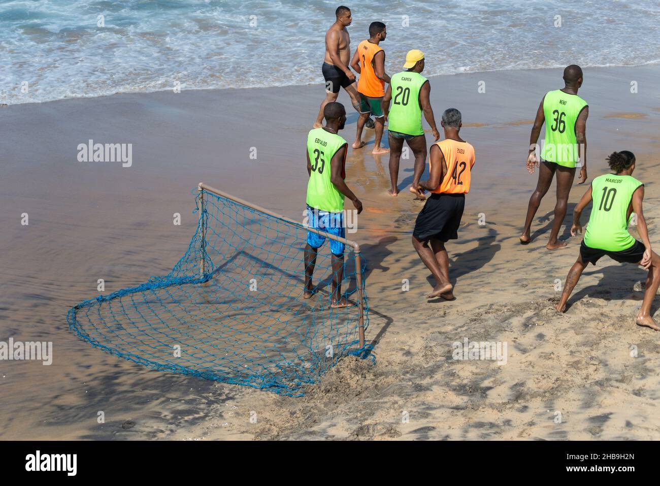 People Playing Sand Football At Farol Da Barra Beach In Salvador City Bahia Brazil Stock Photo