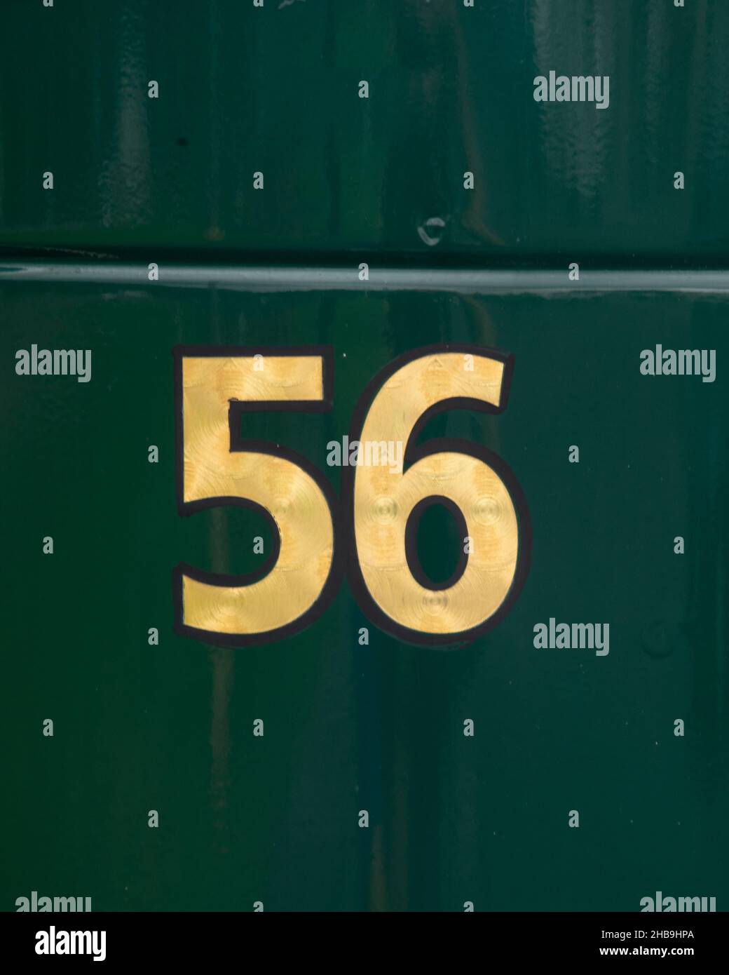 Number 56 in gold painted on a green vehicle/truck Stock Photo