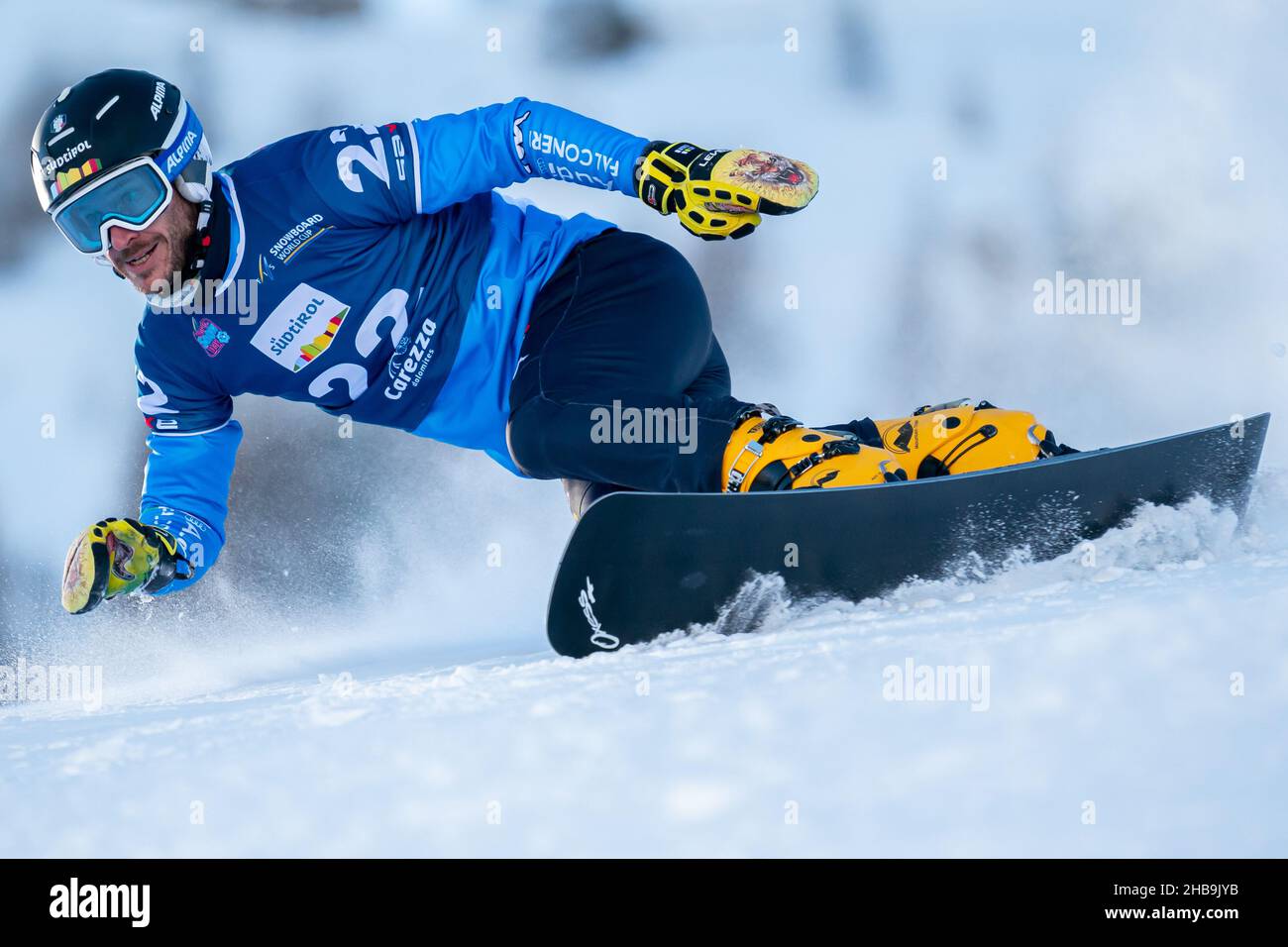 MARCH Aaron (ITA) competing in the Fis Snowboard World Cup 2022  Men's Parallel Giant Slalom on the Pra Di Tori (Carezza) Course in the dolomite mountain range Stock Photo