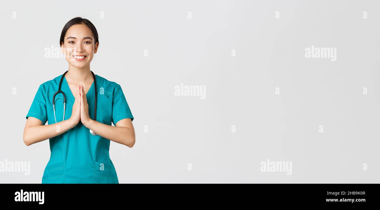 Female asian doctor praying hi-res stock photography and images - Alamy