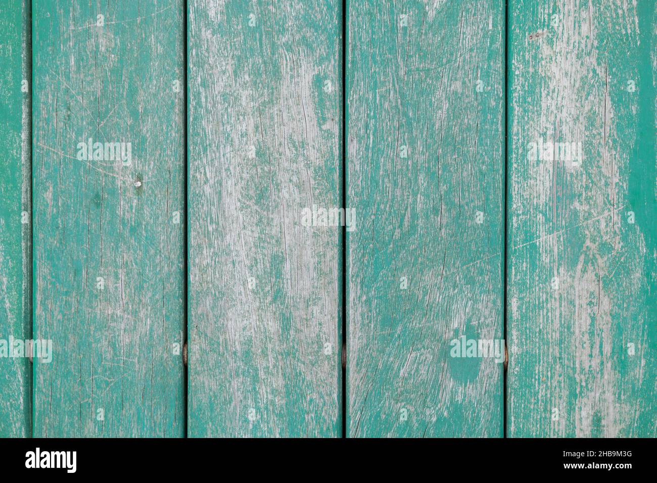 background with wooden plank with straight lines in turquoise color, detail of colorful worn material Stock Photo