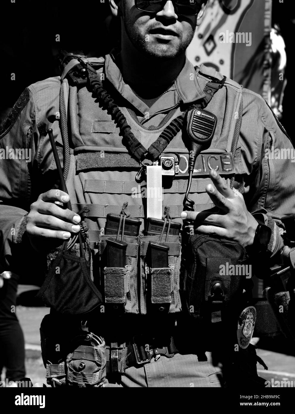 A member of the Santa Fe, New Mexico, SWAT team keeps on eye on the crowd enjoying an outdoor public event. Stock Photo