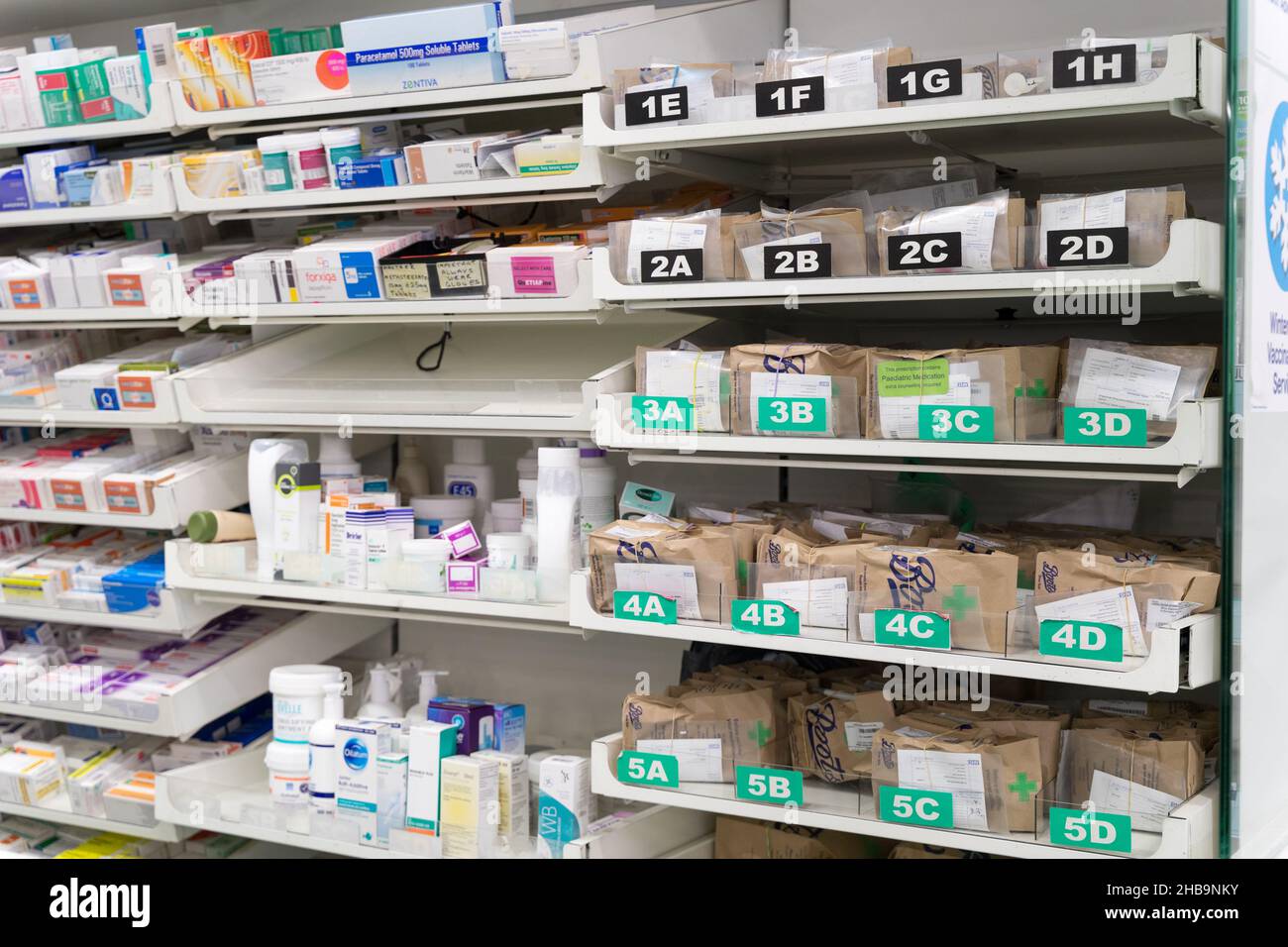 Medicines dispenser labelled by combination of alphabet letters