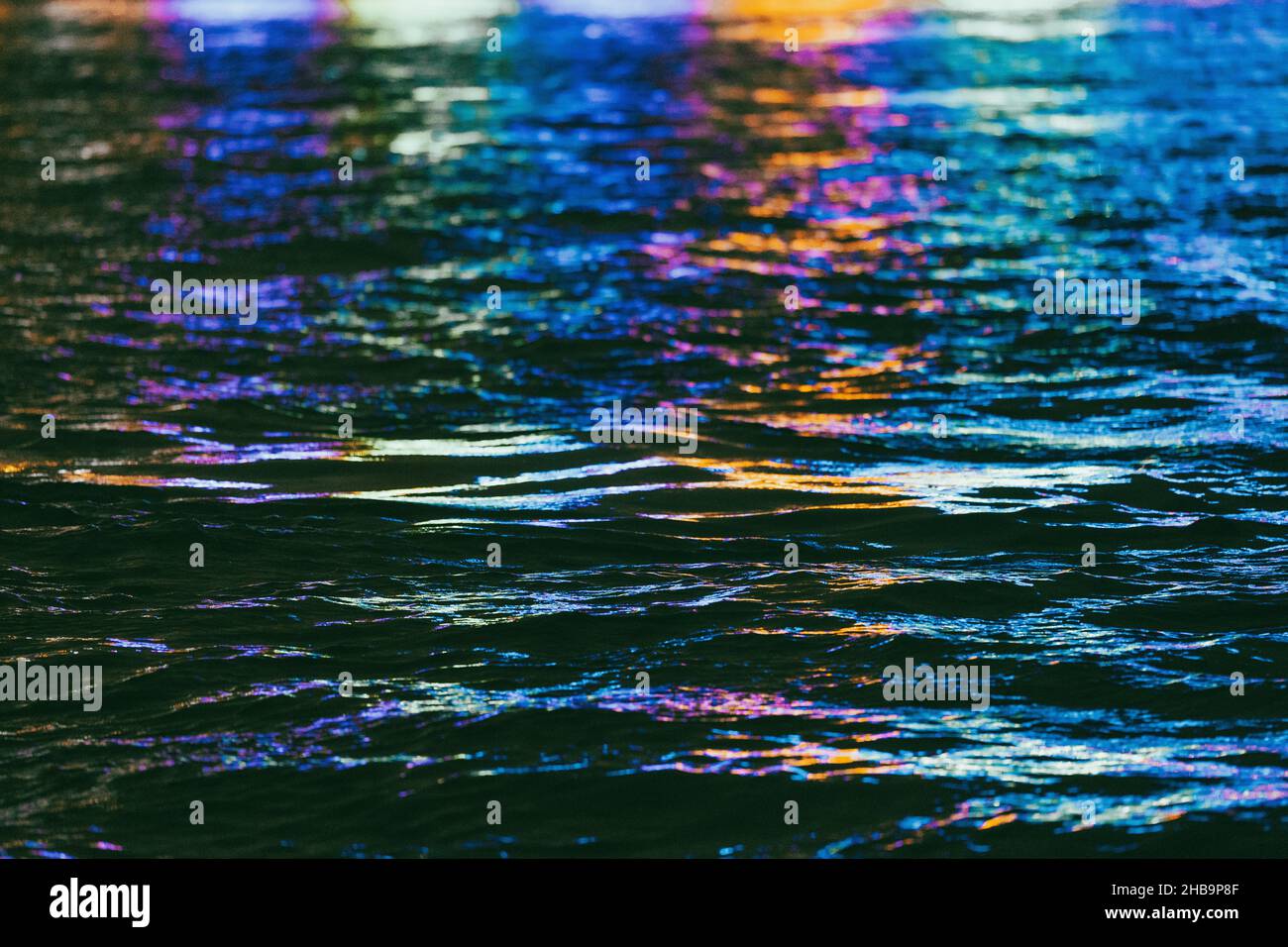 colour lights reflection on the water surface of river thames Stock Photo