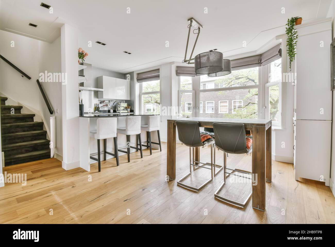 Modern dining area with kitchen with unusual chandelier Stock Photo - Alamy - Exotic Modern Kitchen Dining Room Set With Chandelier