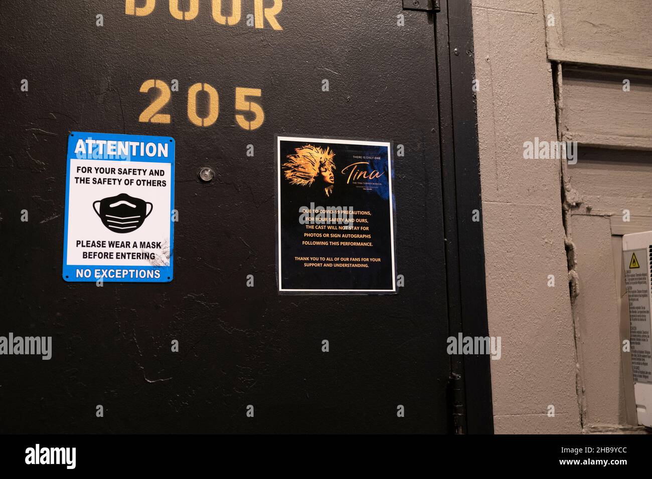 New York, NY - December 17, 2021: View of warning sign on door of Lunt-Fontanne Theatre where the musical Tina has been canceled due to sweeping COVID-19 surge Stock Photo