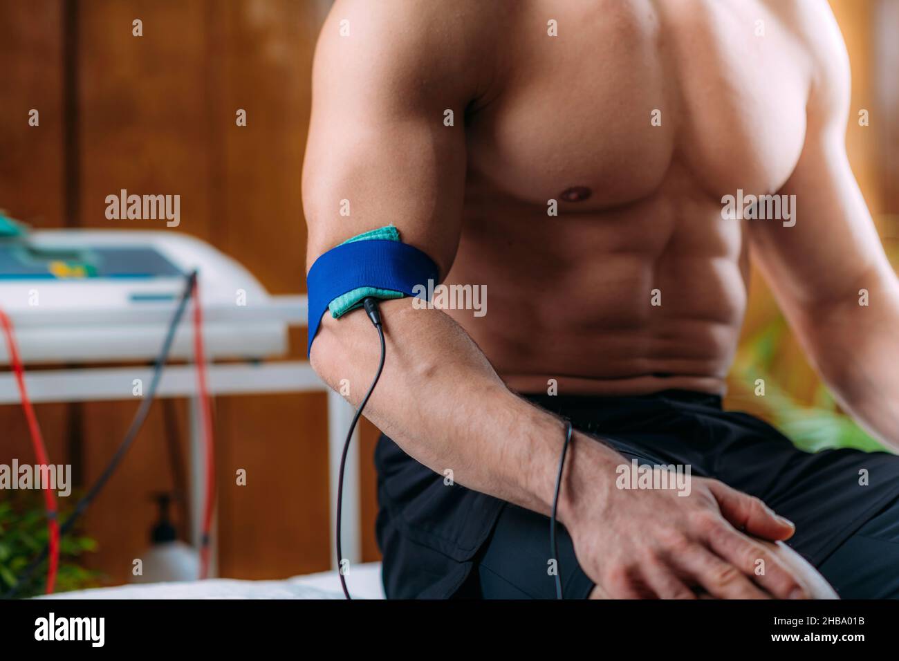 Elbow physical therapy with TENS (transcutaneous electrical nerve